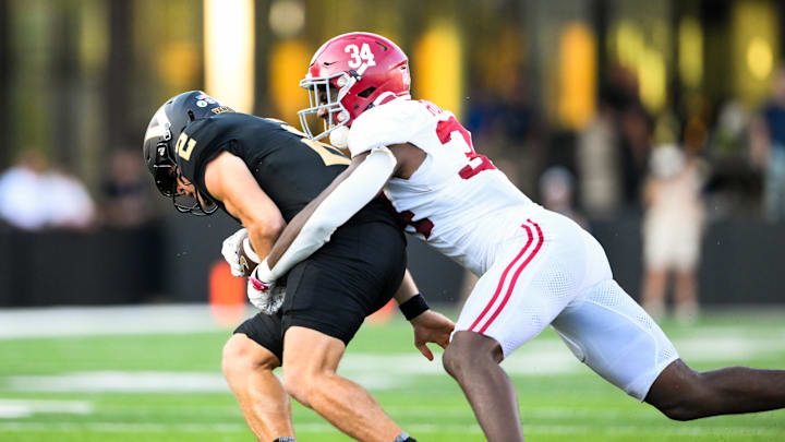 Oct 5, 2024; Nashville, Tennessee, USA; Alabama Crimson Tide linebacker Que Robinson (34) tackles Vanderbilt Commodores quarterback Diego Pavia (2) during the second half at FirstBank Stadium. Oct 5, 2024; Nashville, Tennessee, USA; Alabama Crimson Tide linebacker Que Robinson (34) tackles Vanderbilt Commodores quarterback Diego Pavia (2) during the second half at FirstBank Stadium.