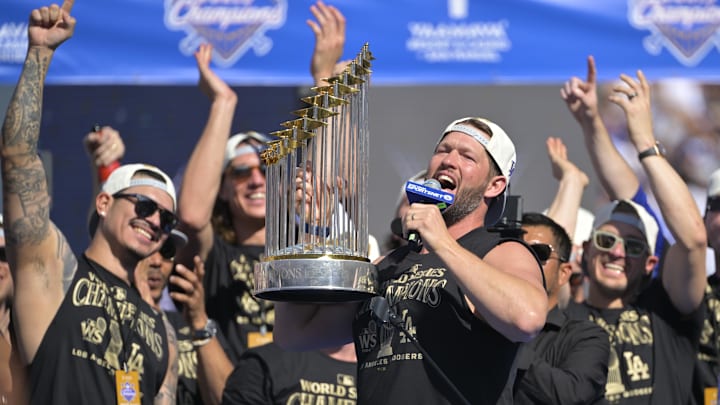 Nov 1, 2024; Los Angeles, CA, USA; starting pitcher Clayton Kershaw (22) lifts the World Series Championship Trophy during the team celebration at Dodger Stadium. Mandatory Credit: Jayne Kamin-Oncea-Imagn Images Nov 1, 2024; Los Angeles, CA, USA; starting pitcher Clayton Kershaw (22) lifts the World Series Championship Trophy during the team celebration at Dodger Stadium. Mandatory Credit: Jayne Kamin-Oncea-Imagn Images