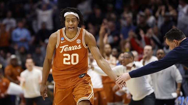 Mar 19, 2025; Dayton, OH, USA; Texas Longhorns guard Tre Johnson (20) high-fives Xavier Musketeers head coach Sean Miller after making a three-point basket in the second half at UD Arena.