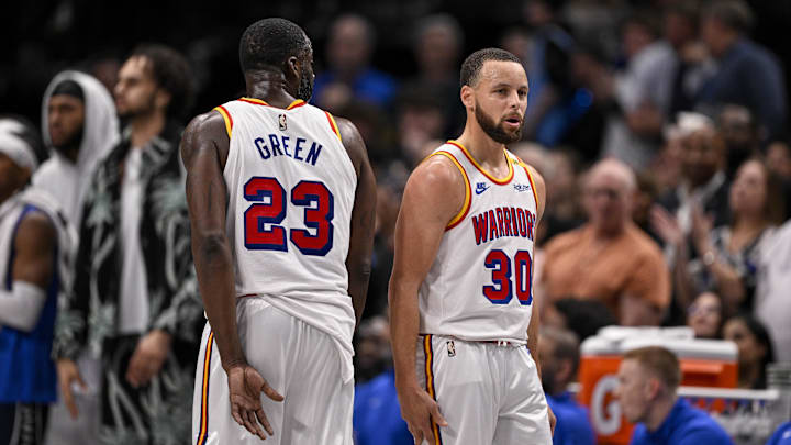 Feb 12, 2025; Dallas, Texas, USA; Golden State Warriors forward Draymond Green (23) and guard Stephen Curry (30) during the game between the Dallas Mavericks and the Golden State Warriors at the American Airlines Center. Mandatory Credit: Jerome Miron-Imagn Images