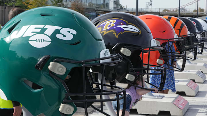 Oct 7, 2023; London, United Kingdom; Large oversized helmets of the New York Jets Baltimore Ravens, Cleveland Browns and Cincinnati Bengals at the NFL Experience London at the Battersea Power Station. Mandatory Credit: Kirby Lee-Imagn Images