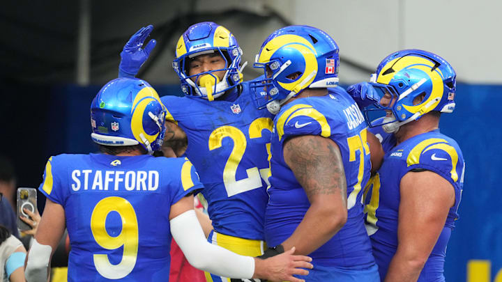 Dec 8, 2024; Inglewood, California, USA; Los Angeles Rams running back Kyren Williams (23) celebrates with quarterback Matthew Stafford (9) and offensive tackle Alaric Jackson (77) after scoring in a 7-yard touchdown run against the Buffalo Bills in the third quarter at SoFi Stadium. Mandatory Credit: Kirby Lee-Imagn Images