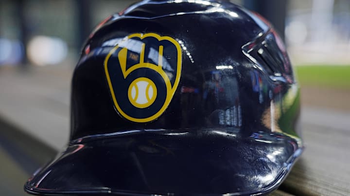 Jun 10, 2024; Milwaukee, Wisconsin, USA;  A Milwaukee Brewers batting helmet sits on the bench during batting practice prior to the game against the Toronto Blue Jays at American Family Field. Mandatory Credit: Jeff Hanisch-Imagn Images