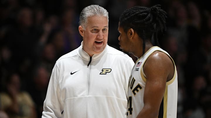 Purdue Boilermakers head coach Matt Painter shares a moment with guard Gicarri Harris (24) 
