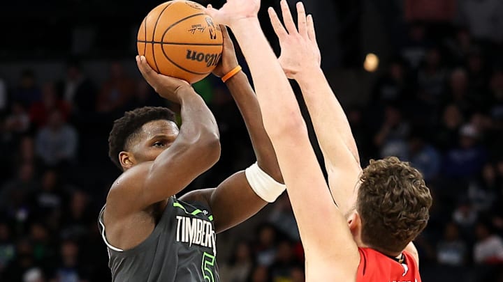 Feb 6, 2025; Minneapolis, Minnesota, USA; Minnesota Timberwolves guard Anthony Edwards (5) shoots as Houston Rockets center Alperen Sengun (28) defends during the fourth quarter at Target Center. Mandatory Credit: Matt Krohn-Imagn Images