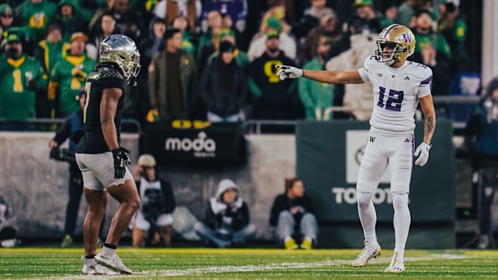 Denzel Boston gestures to an Oregon defender in Eugene in 2024.