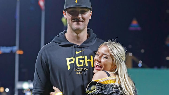 Pittsburgh Pirates starting pitcher Paul Skenes (30) poses with his girlfriend Louisiana State University gymnast Livvy Dunne after Skenes made his major league debut against the Chicago Cubs at PNC Park. Pittsburgh Pirates starting pitcher Paul Skenes (30) poses with his girlfriend Louisiana State University gymnast Livvy Dunne after Skenes made his major league debut against the Chicago Cubs at PNC Park.