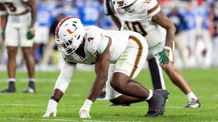 Jan 8, 2026; Glendale, AZ, USA; Miami Hurricanes defensive lineman Rueben Bain Jr. (4) against the Mississippi Rebels during the 2026 Fiesta Bowl and semifinal game of the College Football Playoff at State Farm Stadium. Mandatory Credit: Mark J. Rebilas-Imagn Images