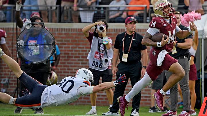 Oct 3, 2026; Tallahassee, Fla.: Virginia Cavaliers safety Ethan Minter (30) fails to bring down Florida State Seminoles quarterback Ashton Daniels (14) as he runs for a touchdown at Doak S. Campbell Stadium. Mandatory Credit: Melina Myers-Imagn Images Oct 3, 2026; Tallahassee, Fla.: Virginia Cavaliers safety Ethan Minter (30) fails to bring down Florida State Seminoles quarterback Ashton Daniels (14) as he runs for a touchdown at Doak S. Campbell Stadium. Mandatory Credit: Melina Myers-Imagn Images