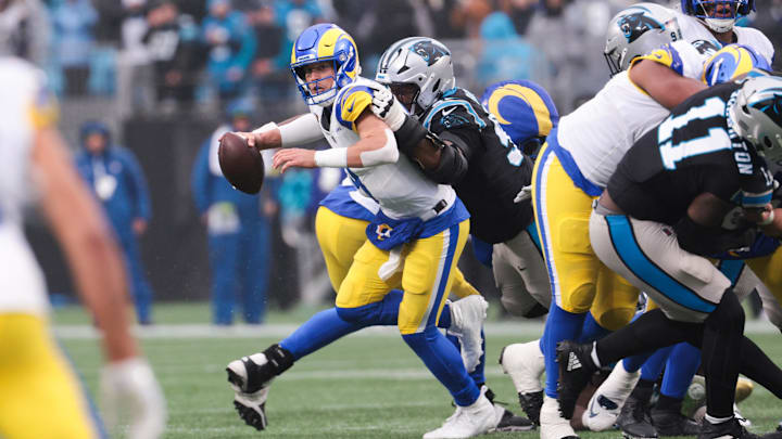 Nov 30, 2025; Charlotte, North Carolina, USA; Los Angeles Rams quarterback Matthew Stafford (9) is sacked by Carolina Panthers defensive end Derrick Brown (95) during the fourth quarter at Bank of America Stadium. Mandatory Credit: Scott Kinser-Imagn Images Nov 30, 2025; Charlotte, North Carolina, USA; Los Angeles Rams quarterback Matthew Stafford (9) is sacked by Carolina Panthers defensive end Derrick Brown (95) during the fourth quarter at Bank of America Stadium. Mandatory Credit: Scott Kinser-Imagn Images