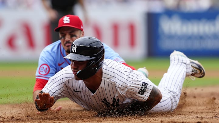 Aug 31, 2024; Bronx, New York, USA; New York Yankees second baseman Gleyber Torres (25) is tagged out by St. Louis Cardinals third baseman Nolan Arenado (28) in a run down during the eighth inning at Yankee Stadium. Mandatory Credit: Gregory Fisher-Imagn Images