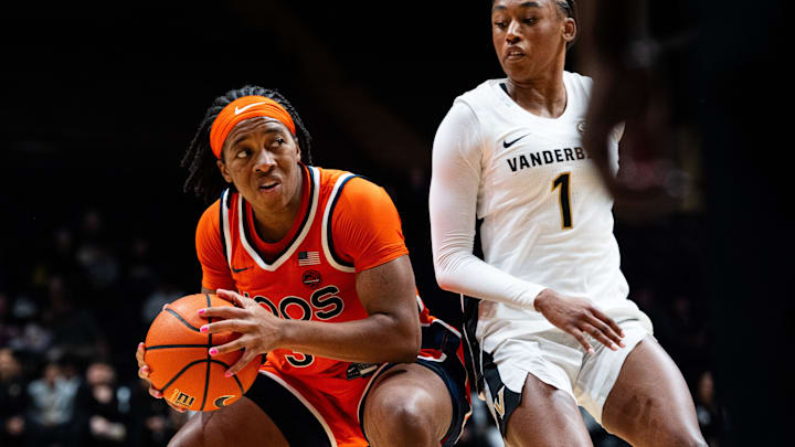 Virginia Cavaliers guard Gabby White (3) looks while Vanderbilt Commodores guard Mikayla Blakes (1) guards during the women’s basketball game between the Vanderbilt Commodores and Virginia Cavaliers at Vanderbilt's Memorial Gymnasium in Nashville on Wednesday, Dec. 3, 2025. Virginia Cavaliers guard Gabby White (3) looks while Vanderbilt Commodores guard Mikayla Blakes (1) guards during the women’s basketball game between the Vanderbilt Commodores and Virginia Cavaliers at Vanderbilt's Memorial Gymnasium in Nashville on Wednesday, Dec. 3, 2025.