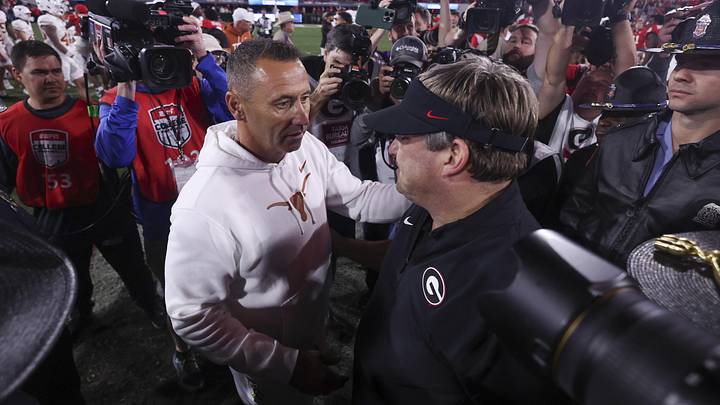 Nov 15, 2025; Athens, Georgia, USA; Texas Longhorns head coach Steve Sarkisian and Georgia Bulldogs head coach Kirby Smart interact after a game at Sanford Stadium. Mandatory Credit: Brett Davis-Imagn Images