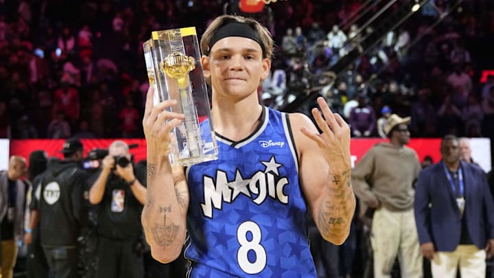 Feb 15, 2025; San Francisco, CA, USA; Osceola Magic guard Mac McClung celebrates with the trophy after winning the slam dunk competition during All Star Saturday Night ahead of the 2025 NBA All Star Game at Chase Center. Mandatory Credit: Kyle Terada-Imagn Images