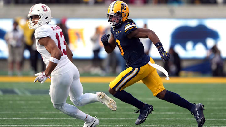 Nov 23, 2024; Berkeley, California, USA; California Golden Bears defensive back Nohl Williams (right) defends against Stanford Cardinal wide receiver Elic Ayomanor (13) during the fourth quarter at California Memorial Stadium. Mandatory Credit: Darren Yamashita-Imagn Images