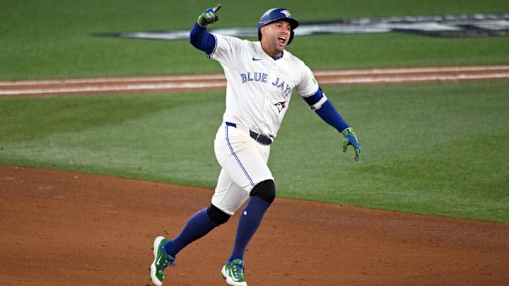 Oct 20, 2025; Toronto, Ontario, CAN; Toronto Blue Jays right fielder George Springer (4) celebrates as he runs the bases after hitting a three run home run against the Seattle Mariners in the seventh inning during game seven of the ALCS round for the 2025 MLB playoffs at Rogers Centre. Mandatory Credit: Dan Hamilton-Imagn Images Oct 20, 2025; Toronto, Ontario, CAN; Toronto Blue Jays right fielder George Springer (4) celebrates as he runs the bases after hitting a three run home run against the Seattle Mariners in the seventh inning during game seven of the ALCS round for the 2025 MLB playoffs at Rogers Centre. Mandatory Credit: Dan Hamilton-Imagn Images