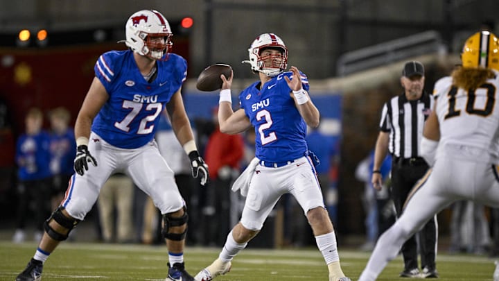 Nov 30, 2024; Dallas, Texas, USA; Southern Methodist Mustangs quarterback Preston Stone (2) passes for a touchdown to wide receiver Key'Shawn Smith (not pictured) during the second half against the California Golden Bears at Gerald J. Ford Stadium. Mandatory Credit: Jerome Miron-Imagn Images