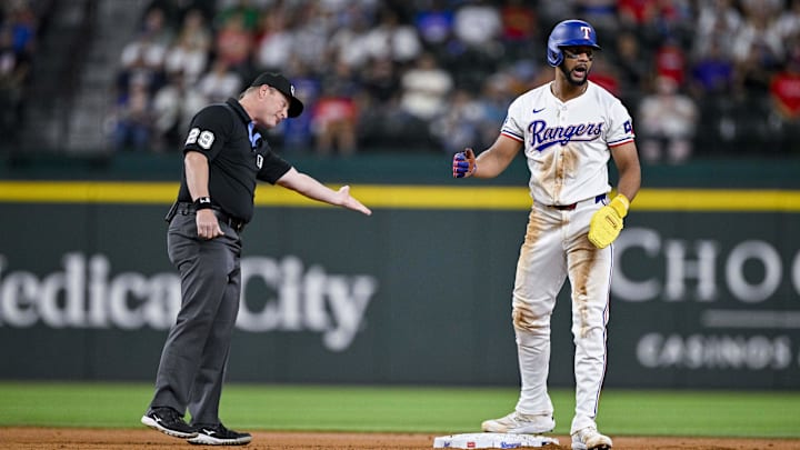 Arlington, Texas, USA; Texas Rangers center fielder Leody Taveras (3) argues a call with umpire Sean Barber (29) during the second inning at Globe Life Field. Arlington, Texas, USA; Texas Rangers center fielder Leody Taveras (3) argues a call with umpire Sean Barber (29) during the second inning at Globe Life Field.