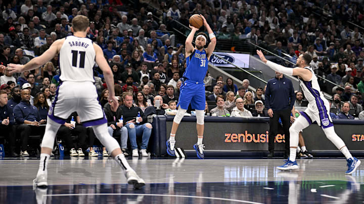 Feb 10, 2025; Dallas, Texas, USA; Dallas Mavericks guard Klay Thompson (31) makes a three point shot against the Sacramento Kings during the second quarter at the American Airlines Center. Mandatory Credit: Jerome Miron-Imagn Images