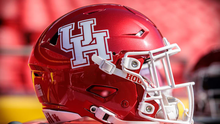 Oct 19, 2024; Kansas City, Missouri, USA; Houston Cougars helmet on the sidelines prior to the game against the Kansas Jayhawks at GEHA Field at Arrowhead Stadium. Mandatory Credit: William Purnell-Imagn Images Oct 19, 2024; Kansas City, Missouri, USA; Houston Cougars helmet on the sidelines prior to the game against the Kansas Jayhawks at GEHA Field at Arrowhead Stadium. Mandatory Credit: William Purnell-Imagn Images