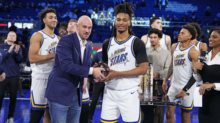 February 14, 2025; San Francisco, California, USA; Team C guard Stephon Castle (5) of the San Antonio Spurs holds the trophy during the 2025 NBA Rising Stars Game at Chase Center. Mandatory Credit: Kyle Terada-Imagn Images