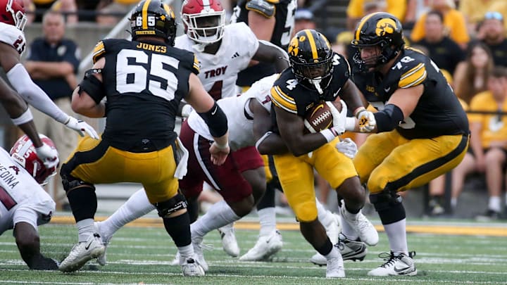 Iowa’s Leshon Williams (4) runs the ball against Troy Saturday, Sept. 14, 2024 at Kinnick Stadium in Iowa City, Iowa.