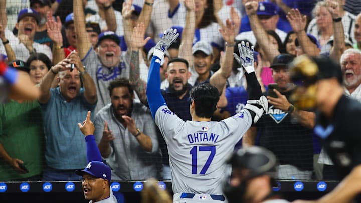 Sep 19, 2024; Miami, Florida, USA; Los Angeles Dodgers designated hitter Shohei Ohtani (17) reacts to a standing ovation from the fans after hitting his 50th home run of the season against the Miami Marlins during the seventh inning at loanDepot Park