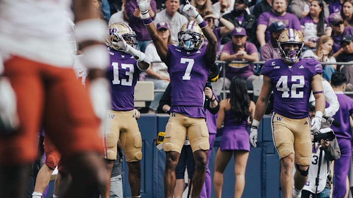 Ephesians Prysock and Carson Bruener emerge from an Apple Cup play.