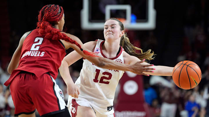 Oklahoma Sooners guard Payton Verhulst (12) passes the ball beside NC State Wolfpack guard Qadence Samuels (2) during a women's college basketball game between the University of Oklahoma Sooners (OU) and the NC State Wolfpack at Lloyd Noble Center in Norman, Okla., on Dec. 3. Oklahoma Sooners guard Payton Verhulst (12) passes the ball beside NC State Wolfpack guard Qadence Samuels (2) during a women's college basketball game between the University of Oklahoma Sooners (OU) and the NC State Wolfpack at Lloyd Noble Center in Norman, Okla., on Dec. 3.
