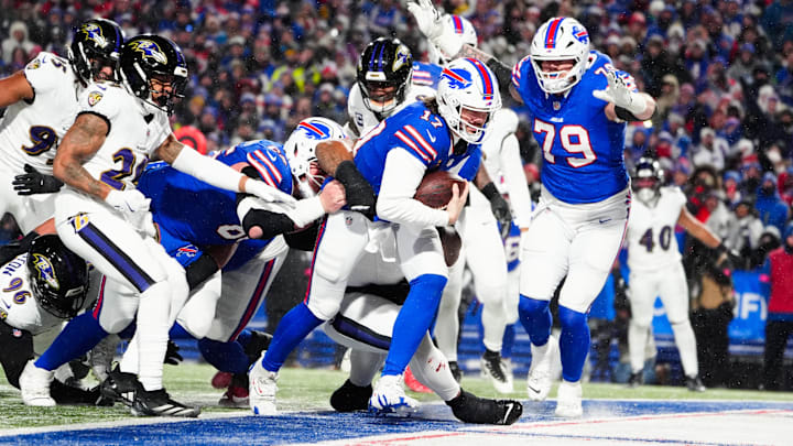 Jan 19, 2025; Orchard Park, New York, USA; Buffalo Bills quarterback Josh Allen (17) rushes for a touchdown during the second quarter against the Baltimore Ravens in a 2025 AFC divisional round game at Highmark Stadium. Mandatory Credit: Gregory Fisher-Imagn Images