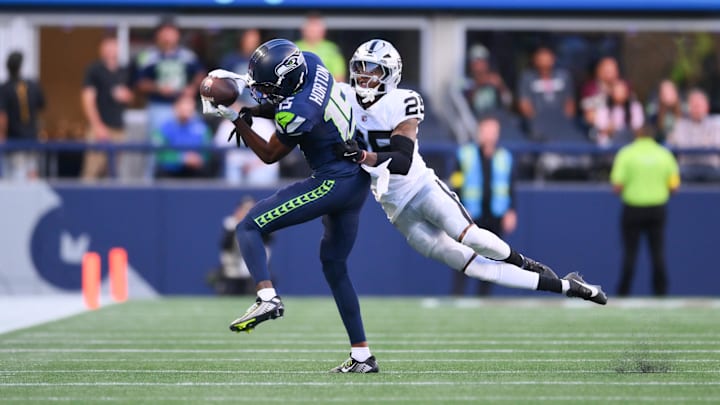 Aug 7, 2025; Seattle, Washington, USA; Seattle Seahawks wide receiver Tory Horton (15) catches a pass while covered by Las Vegas Raiders cornerback Decamerion Richardson (25) during the first half at Lumen Field. Mandatory Credit: Steven Bisig-Imagn Images Aug 7, 2025; Seattle, Washington, USA; Seattle Seahawks wide receiver Tory Horton (15) catches a pass while covered by Las Vegas Raiders cornerback Decamerion Richardson (25) during the first half at Lumen Field. Mandatory Credit: Steven Bisig-Imagn Images