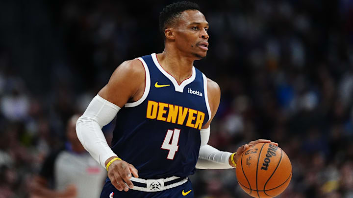 Nov 10, 2024; Denver, Colorado, USA; Denver Nuggets guard Russell Westbrook (4) controls the ball in the first quarter against the Dallas Mavericks at Ball Arena. Mandatory Credit: Ron Chenoy-Imagn Images
