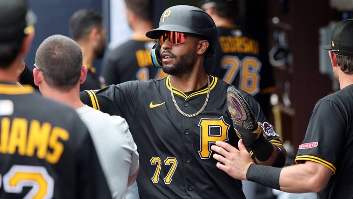 Mar 16, 2025; Tampa, Florida, USA;  Pittsburgh Pirates outfielder Joshua Palacios (77) is congratulated in the dugout after he scored a run during the second inning against the New York Yankees at George M. Steinbrenner Field. Mandatory Credit: Kim Klement Neitzel-Imagn Images