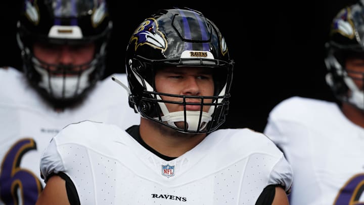 Oct 8, 2023; Pittsburgh, Pennsylvania, USA;  Baltimore Ravens center Tyler Linderbaum (64) takes the field to warm up before the game against the Pittsburgh Steelers at Acrisure Stadium. Mandatory Credit: Charles LeClaire-Imagn Images