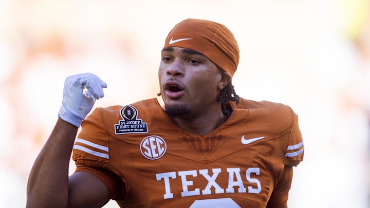 Dec 21, 2024; Austin, Texas, USA; Texas Longhorns wide receiver DeAndre Moore Jr. (0) against the Clemson Tigers during the CFP National playoff first round at Darrell K Royal-Texas Memorial Stadium. Mandatory Credit: Mark J. Rebilas-Imagn Images