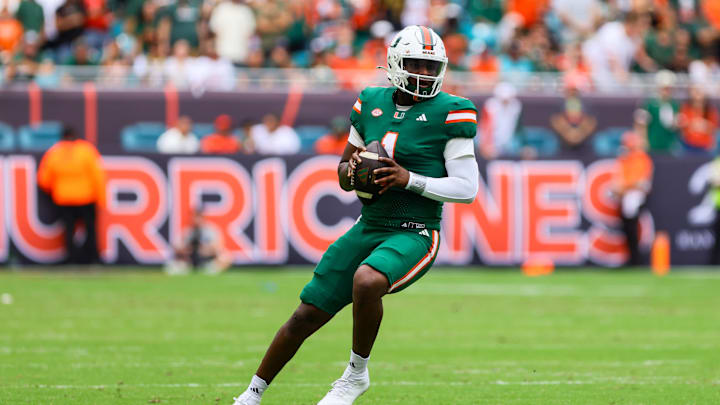 Nov 2, 2024; Miami Gardens, Florida, USA; Miami Hurricanes quarterback Cam Ward (1) looks for a passing option against the Duke Blue Devils during the first quarter at Hard Rock Stadium. Mandatory Credit: Sam Navarro-Imagn Images Nov 2, 2024; Miami Gardens, Florida, USA; Miami Hurricanes quarterback Cam Ward (1) looks for a passing option against the Duke Blue Devils during the first quarter at Hard Rock Stadium. Mandatory Credit: Sam Navarro-Imagn Images