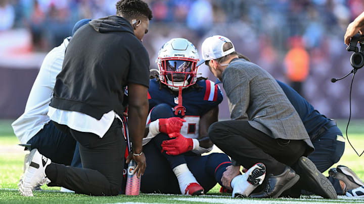 Oct 6, 2024; Foxborough, Massachusetts, USA; New England Patriots running back Rhamondre Stevenson (38) is helped by medical staff during the second half of a game against the Miami Dolphins at Gillette Stadium. Mandatory Credit: Brian Fluharty-Imagn Images Oct 6, 2024; Foxborough, Massachusetts, USA; New England Patriots running back Rhamondre Stevenson (38) is helped by medical staff during the second half of a game against the Miami Dolphins at Gillette Stadium. Mandatory Credit: Brian Fluharty-Imagn Images