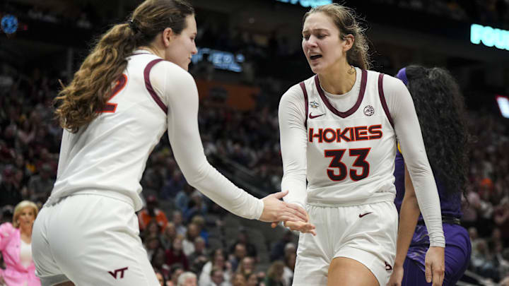 Mar 31, 2023; Dallas, TX, USA; Virginia Tech Hokies guard Cayla King (22) slaps hands with center Elizabeth Kitley (33) during a stop in play against the LSU Lady Tigers in the second half in semifinals of the women's Final Four of the 2023 NCAA Tournament at American Airlines Center. Mandatory Credit: Kirby Lee-Imagn Images Mar 31, 2023; Dallas, TX, USA; Virginia Tech Hokies guard Cayla King (22) slaps hands with center Elizabeth Kitley (33) during a stop in play against the LSU Lady Tigers in the second half in semifinals of the women's Final Four of the 2023 NCAA Tournament at American Airlines Center. Mandatory Credit: Kirby Lee-Imagn Images