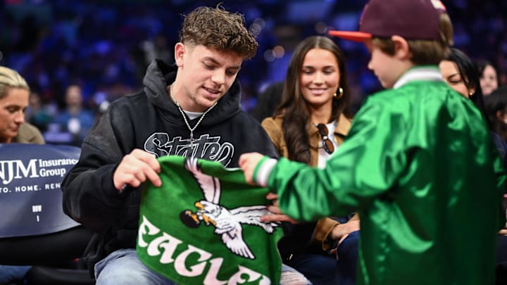 Philadelphia Eagles Cooper DeJean interacts with fans during the game between the Philadelphia 76ers and the Toronto Raptors. Philadelphia Eagles Cooper DeJean interacts with fans during the game between the Philadelphia 76ers and the Toronto Raptors.