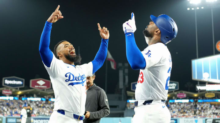Jun 11, 2024; Los Angeles, California, USA; Los Angeles Dodgers right fielder Jason Heyward (23) celebrates with left fielder Teoscar Hernandez (37) after hitting a two-run home run in the sixth inning against the Texas Rangers at Dodger Stadium.