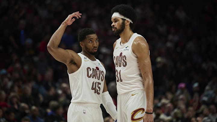 Feb 1, 2026; Portland, Oregon, USA; Cleveland Cavaliers guard Donovan Mitchell (45) talks to center Jarrett Allen (31) during the second half against the Portland Trail Blazers  at Moda Center. Mandatory Credit: Troy Wayrynen-Imagn Images