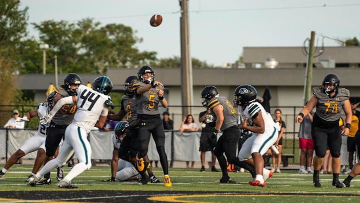 Class of 2028 quarterback Austan Cristiaan (5) throws to a receiver for Bishop Verot in a spring football game against Archbishop McCarthy on May 21. Class of 2028 quarterback Austan Cristiaan (5) throws to a receiver for Bishop Verot in a spring football game against Archbishop McCarthy on May 21.