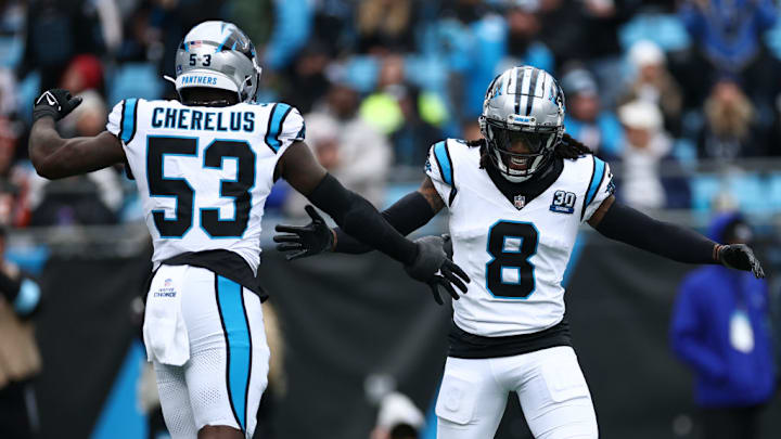 CHARLOTTE, NORTH CAROLINA - DECEMBER 15: Jaycee Horn #8 of the Carolina Panthers celebrates with teammate Claudin Cherelus #53 after a sack against the Dallas Cowboys during the first quarter at Bank of America Stadium on December 15, 2024 in Charlotte, North Carolina. 
