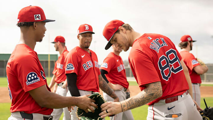 Red Sox pitchers interact during a spring training workout.