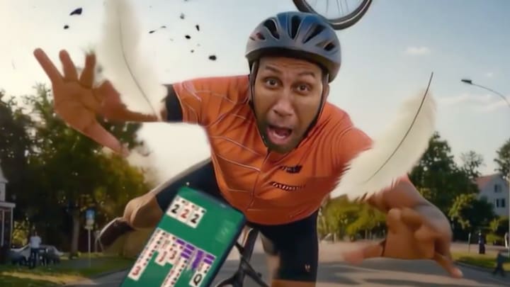 An AI version of Stephen A. Smith tried to play Solitaire Cash on a bicycle. 