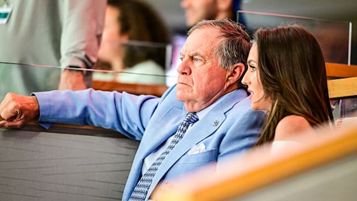 Bill Belichick and Jordon Hudson take in an NHL playoff game.