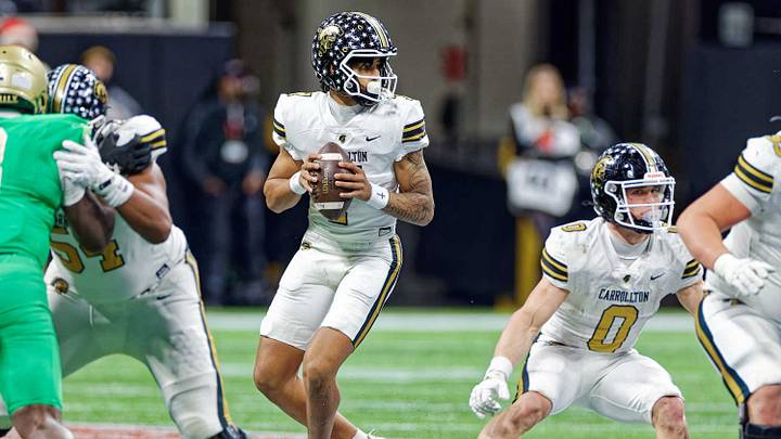 Carrollton freshman quarterback CJ Cypher drops back to pass in the 2025 GHSA Class 6A Championship loss to Buford. Carrollton freshman quarterback CJ Cypher drops back to pass in the 2025 GHSA Class 6A Championship loss to Buford.