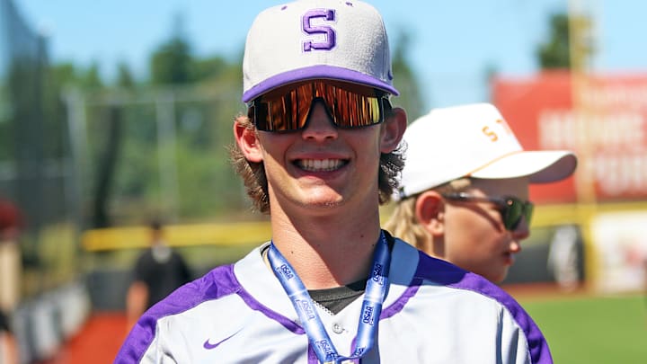 Brady Gilman, 31 years after his father and uncle played on Sunset's 1994 Oregon state championship baseball team, celebrated the same state title joy with the Apollos.