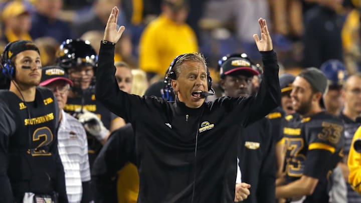 Oct 3, 2015; Hattiesburg, MS, USA; Southern Miss Golden Eagles head coach Todd Monken signals a touchdown in the second half of their game against the North Texas Mean Green at M.M. Roberts Stadium. Southern Miss won, 49-14. Mandatory Credit: Chuck Cook-Imagn Images