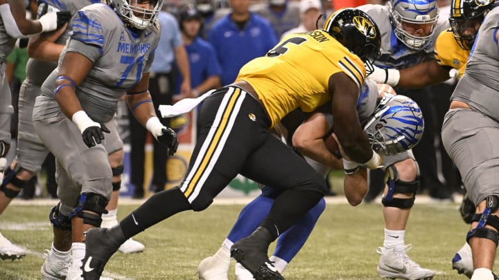 Missouri Tigers defensive lineman Darius Robinson (6) sacks Memphis Tigers quarterback Seth Henigan (2)